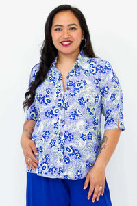 Front view of model wearing tailored blue paisley bamboo linen blouse with elbow-length sleeves
