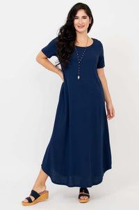 Front view of woman wearing navy blue maxi dress with short sleeves and necklace