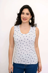 Woman wearing a white nautical print tank top, front view