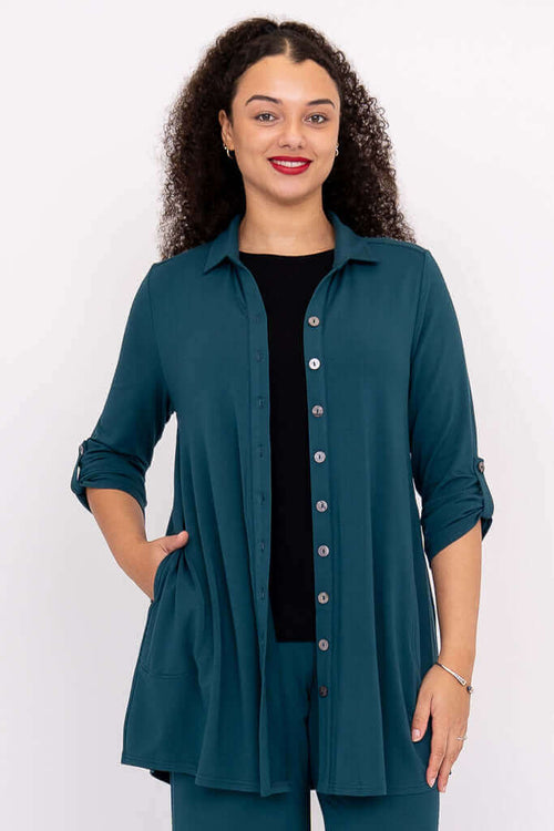 Front view of woman wearing teal bamboo French terry oversized blouse-jacket