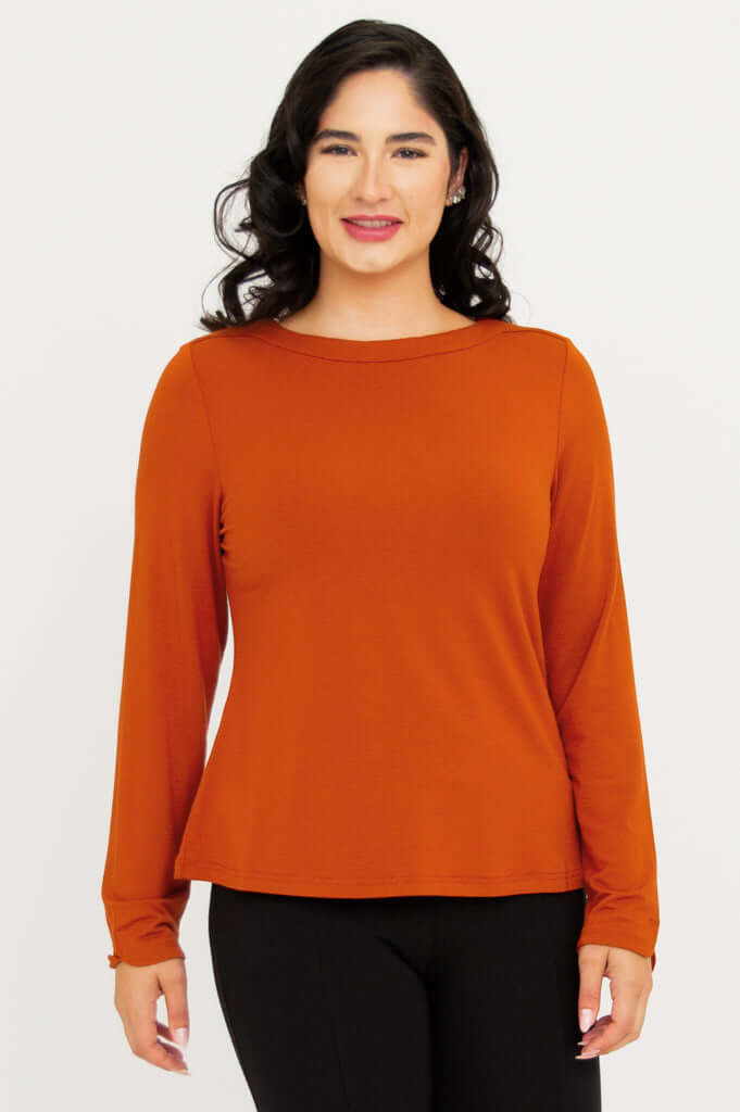 Front view of woman wearing the Mona Bamboo French Terry Tee in burnt orange