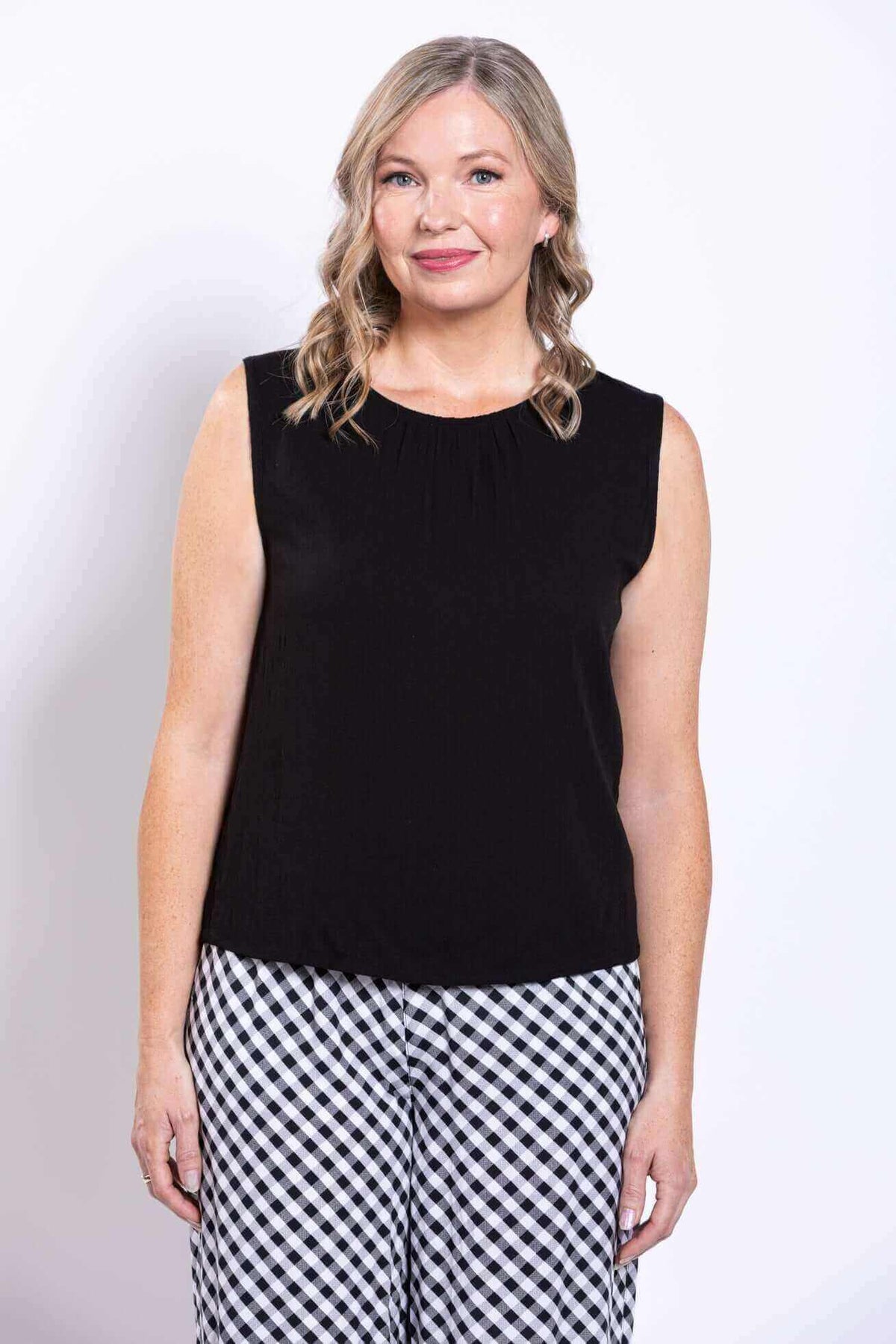 Front view of the model in Nina bamboo linen tank with gathered neckline