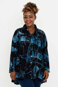 Front view of woman wearing the Peruva top with blue abstract pattern