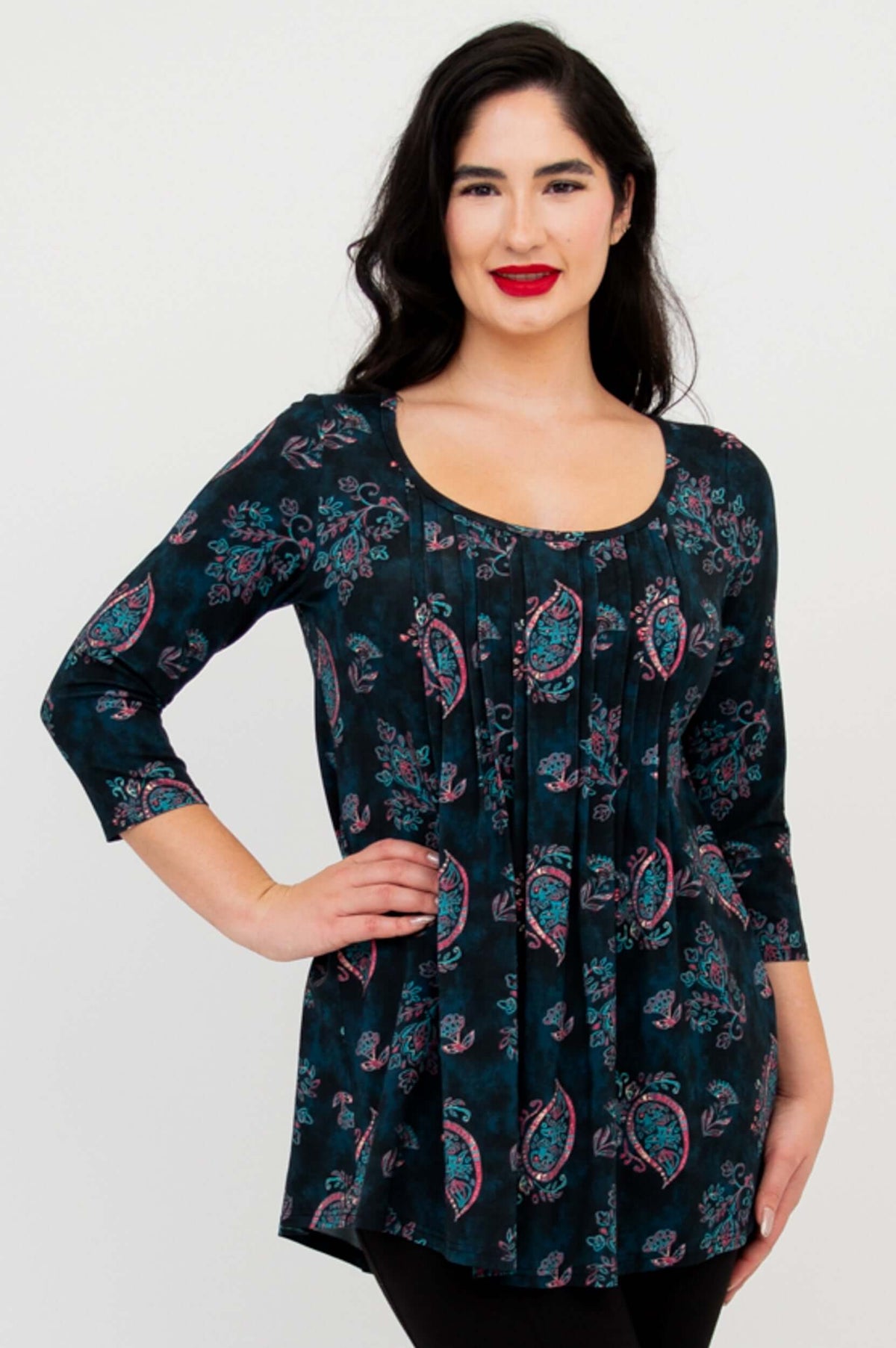 Front view of model wearing Peyton Top in teal paisley print with wide neckline and pleated front