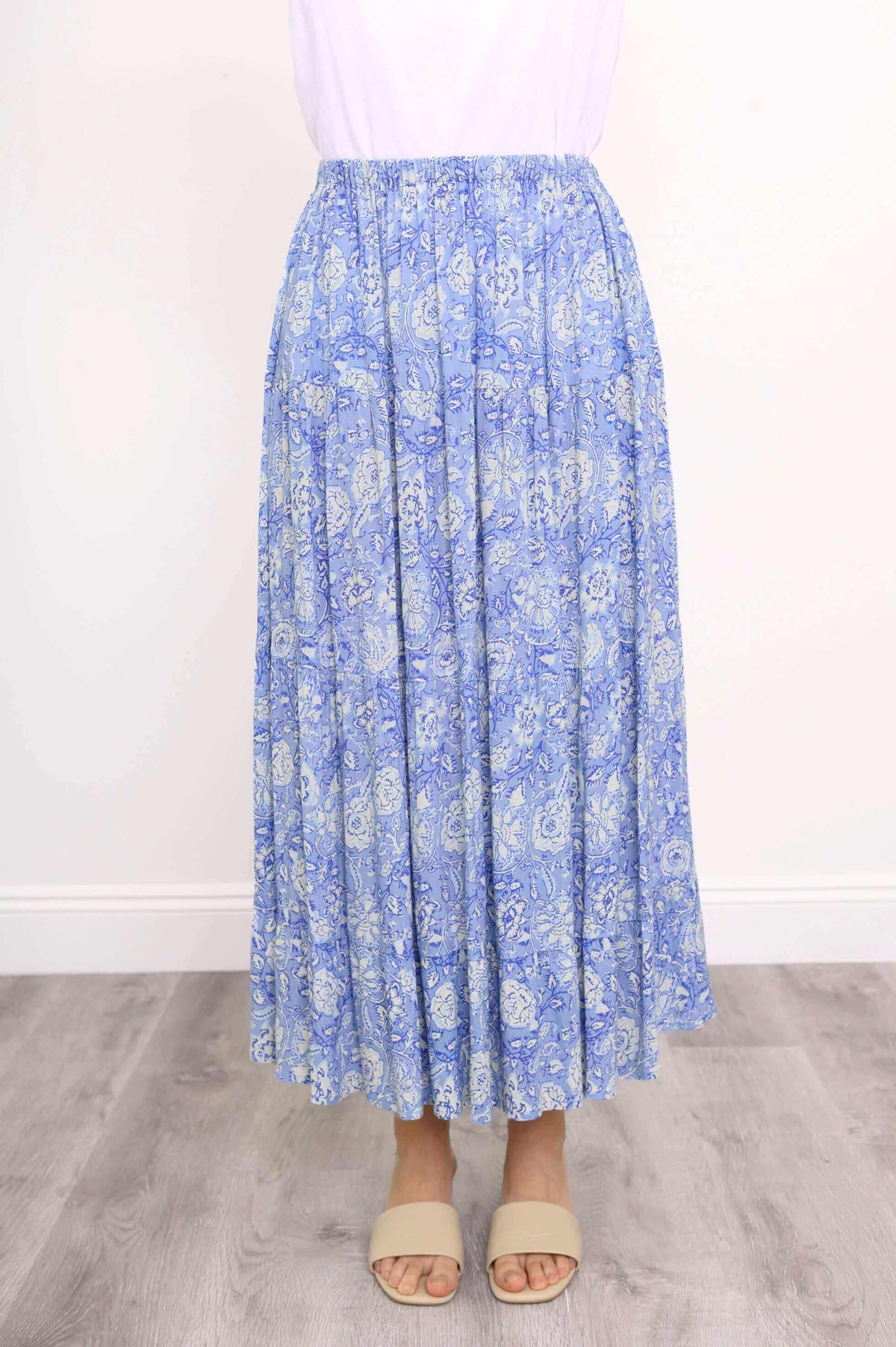 Front view of Roma tiered blue floral skirt with elastic waistband