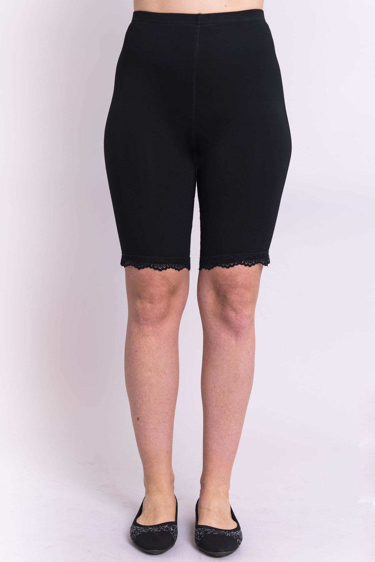 Front view of woman modeling black bamboo undershorts with lace hem