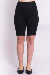 Front view of woman modeling black bamboo undershorts with lace hem