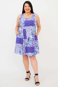 Front view of a woman wearing a sleeveless purple patchwork print A-line summer dress