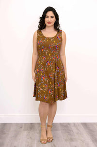 Front view of woman wearing brown floral scoop-neck A-line dress