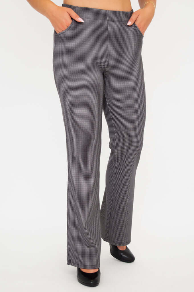 Front view of Sasha bootcut pants with hands in pockets