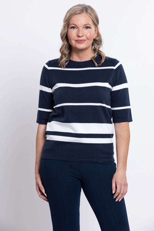 Front view of woman wearing Serena navy and white striped crew neck sweater