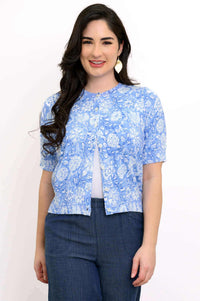 Front view of model wearing Shen short-sleeve cropped cardigan in sky blue floral print