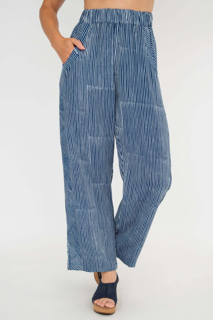 Front view of blue striped pull-on pants with elastic waist and side pockets