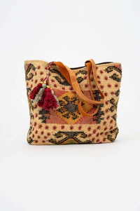 Front view of artisan tote bag with patterned cotton-jute shell and leather handle
