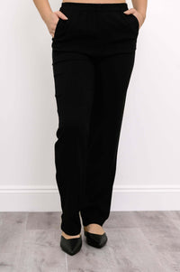 Front view of black bamboo-linen trousers with elastic waistband and pockets