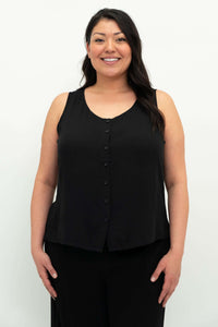 Front view of model wearing a black button-up sleeveless tank top