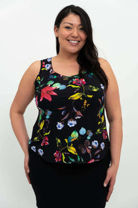 Front view of woman wearing a black tank top with vibrant floral print