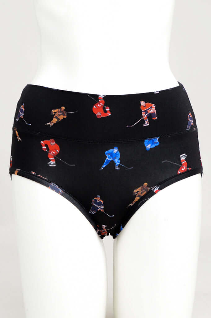 Front view of black high-waist brief with colorful hockey player print on mannequin