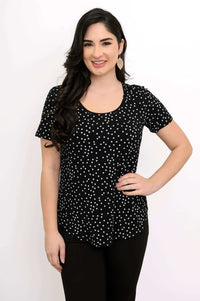 Front view of model wearing a black scoop neck polka dot Tessa Tee