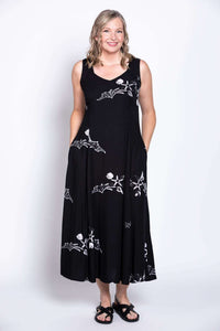 Front view of black summer dress with white prints and sweetheart neckline