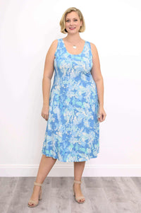 Woman wearing a blue abstract print tank dress standing facing forward