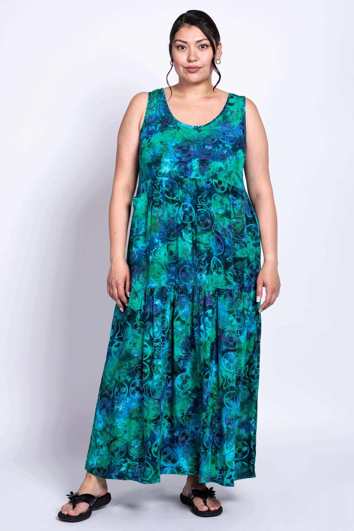 Woman in vibrant green and blue scoop neck maxi dress, front view