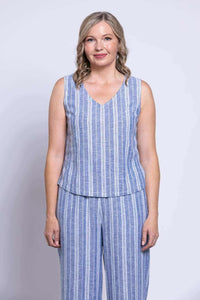 Front view of woman wearing blue and white vertical striped cropped tank and matching pants