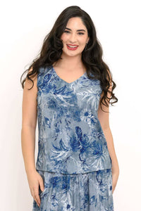 Front view of model wearing blue botanical print V-neck tank top