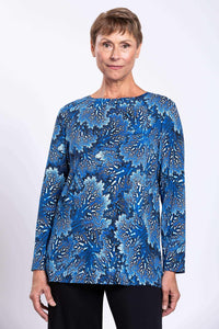 Front view of woman wearing blue coral print long-sleeve relaxed top