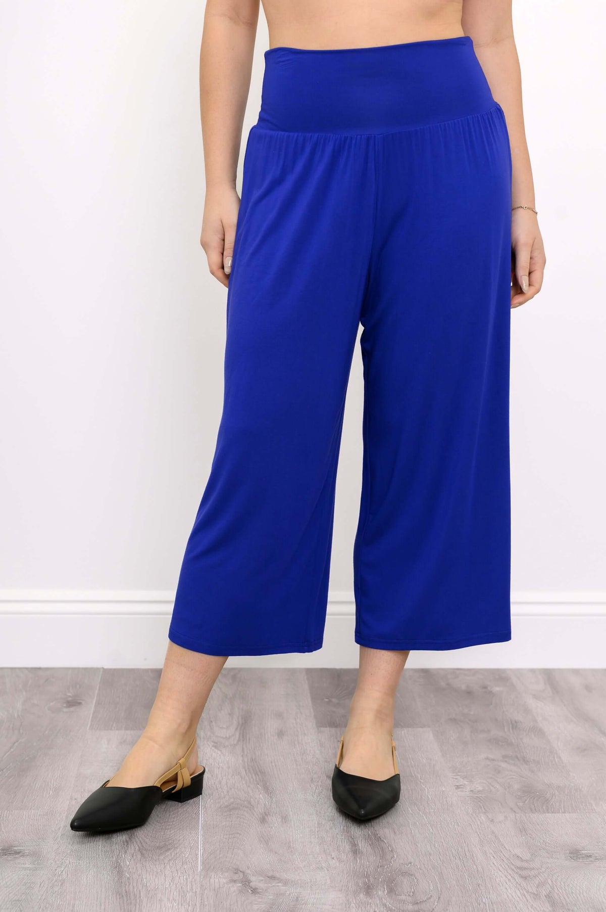Front view of blue cropped palazzo capri pants with wide waistband