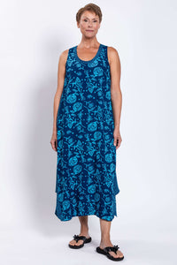 Woman modeling front view of the blue floral midi tank dress, hands by her side