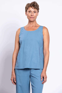 Front view of woman wearing blue linen blend tank and pants