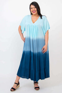 Front view of woman wearing a blue ombre tiered maxi dress with V-neck and short sleeves