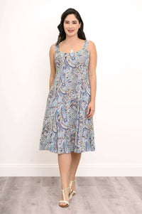 Front view of woman in a blue paisley print A-line midi dress