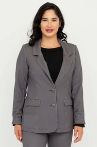 Front view of a woman wearing a tailored checkered blazer with matching trousers