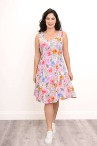 Front view of a woman in a colorful floral bamboo-linen summer dress