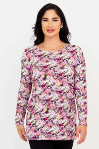 Front view of model wearing a long sleeve floral A-line tunic top