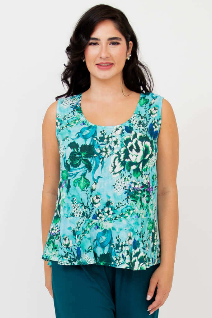 Front view of model wearing floral Ginny Tank top with aqua and green pattern
