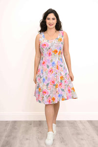 Woman in a floral summer dress posing front view