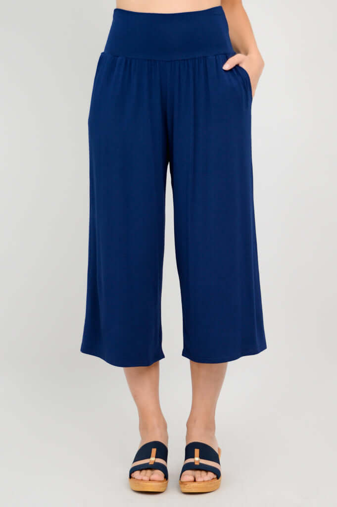 Front view of gaylene bamboo capri pants with hand in pocket, royal blue color