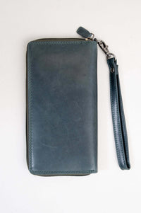 Front view of handmade blue leather wallet with wrist strap