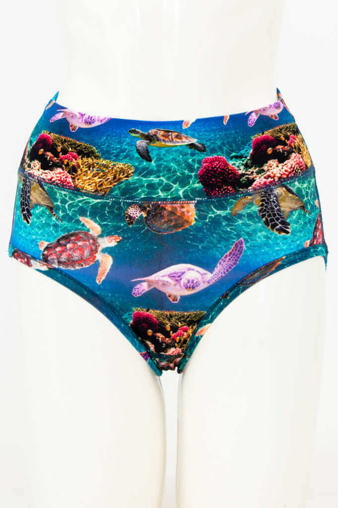 Front view of high waist brief with colorful sea turtle and coral reef print