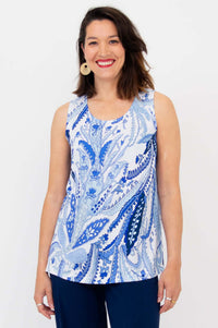 Front view of woman wearing blue and white indigo paisley print tank top with navy pants
