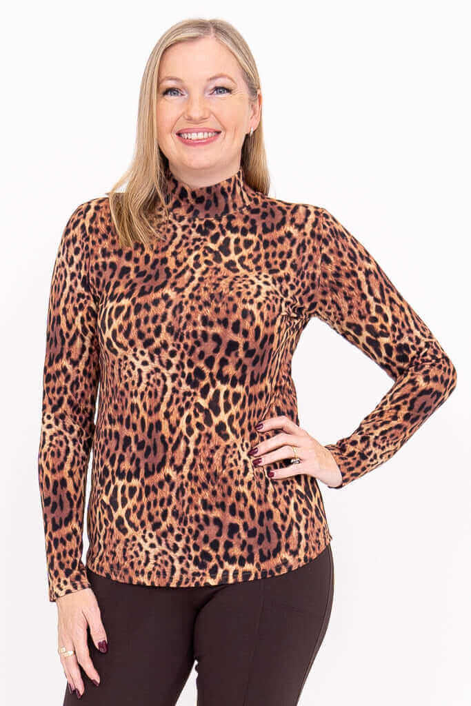 Front view of woman wearing leopard print mock neck long sleeve top