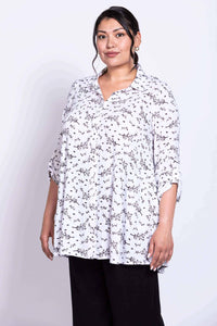 Front view of a model wearing the Celine bamboo-linen tunic with rolled sleeves