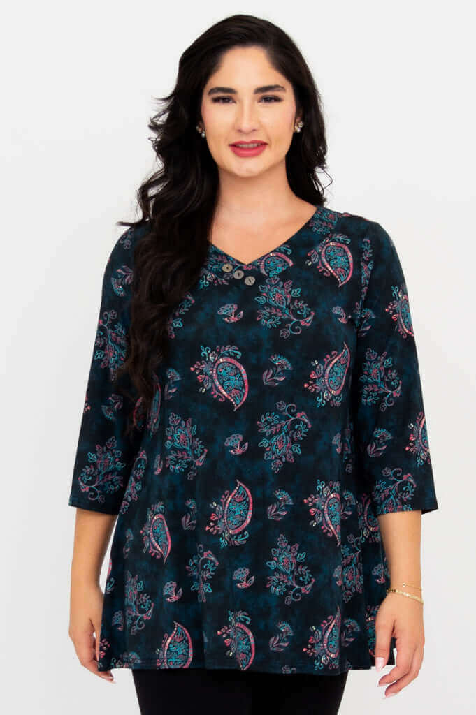 Front view of model wearing Vana Tunic with paisley print and asymmetrical buttons