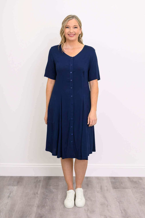 Front view of model in navy blue button-front dress with v-neck and short sleeves