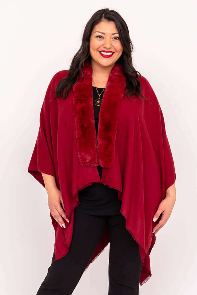 Front view of woman modeling scarlet wrap with faux fur collar