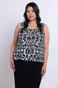 Front view of model wearing sleeveless black and white Ikat tank with button-up detail