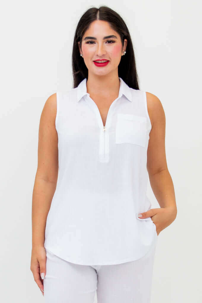 Front view of woman wearing a sleeveless white tank top with zipper and pocket